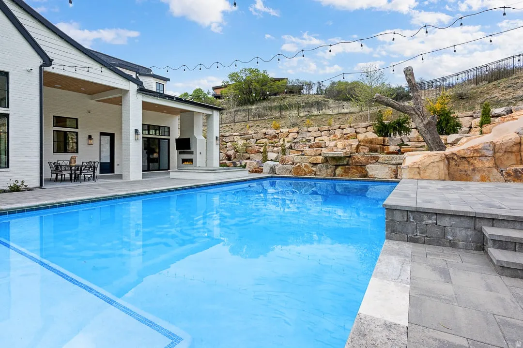 Outdoor pool with a patio