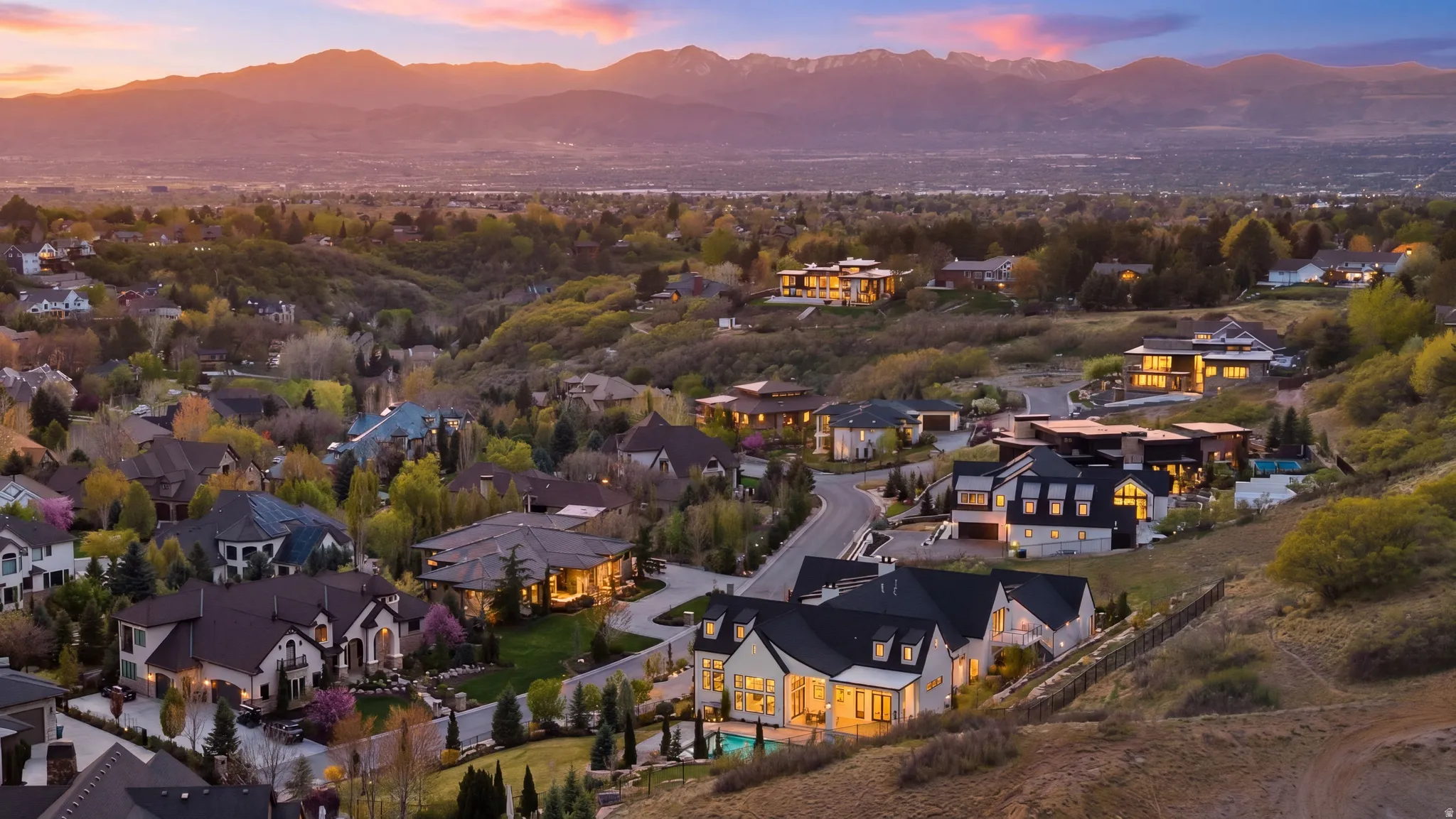 Aerial perspective of suburban area with a mountainous background