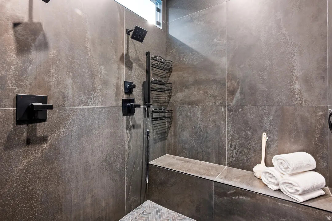 Full bath with a tile shower