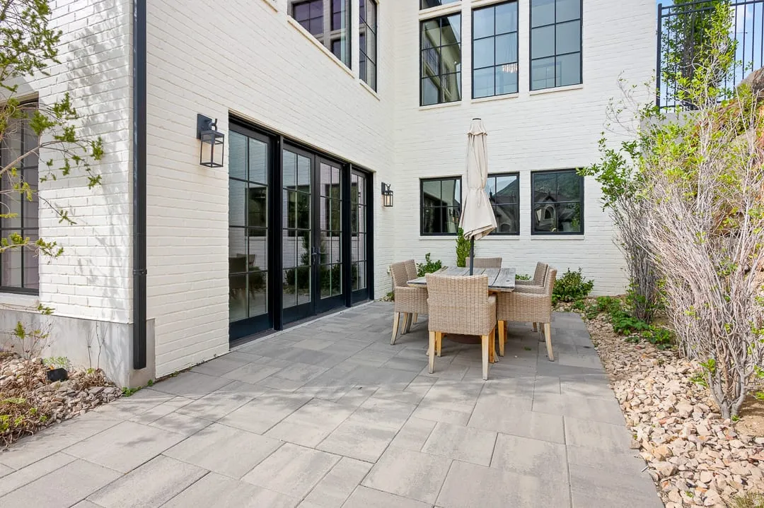 View of patio with outdoor dining area and french doors
