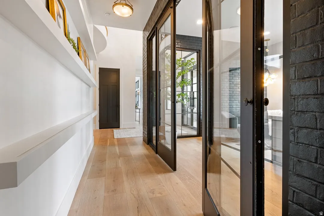 Foyer entrance with french doors and light wood finished floors