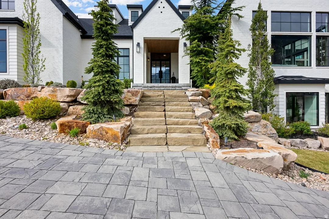 View of exterior entry with brick siding