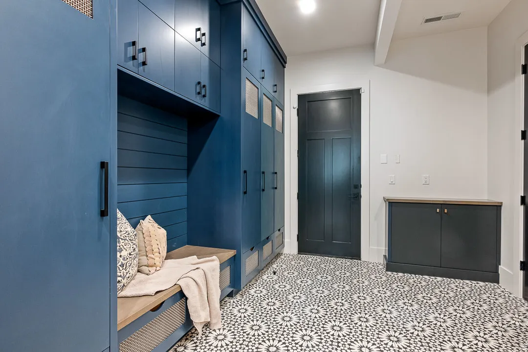 Mudroom featuring beamed ceiling