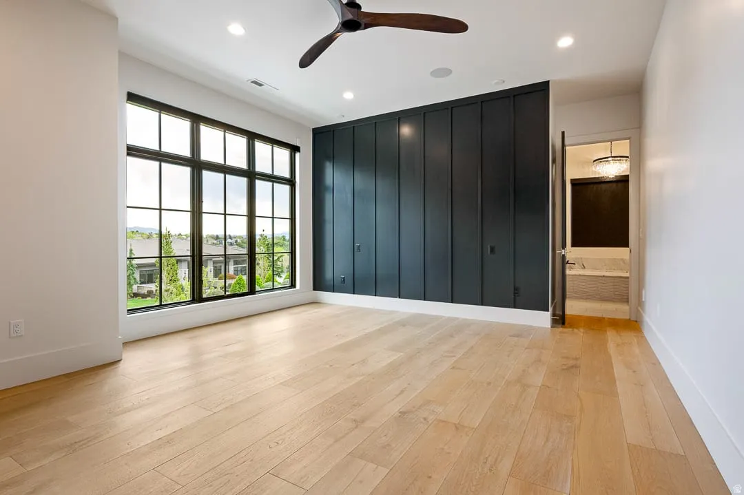 Spare room featuring ceiling fan, light wood-type flooring, and recessed lighting