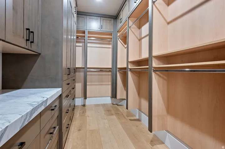 Walk in closet featuring light wood-style floors