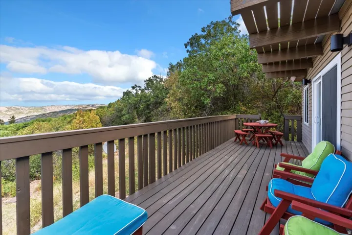 Wooden deck featuring outdoor dining area