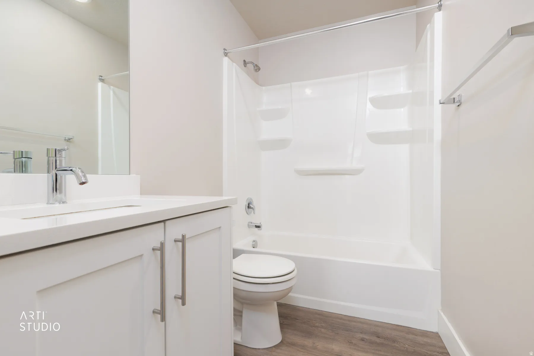 Bathroom featuring vanity, light wood-style floors, and tub / shower combination