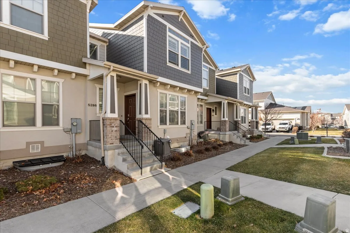 Craftsman house featuring a residential view and a front lawn