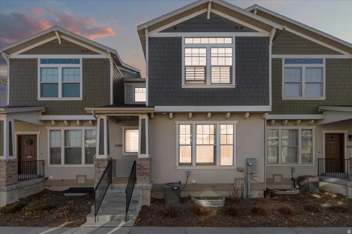 Craftsman-style house with stucco siding