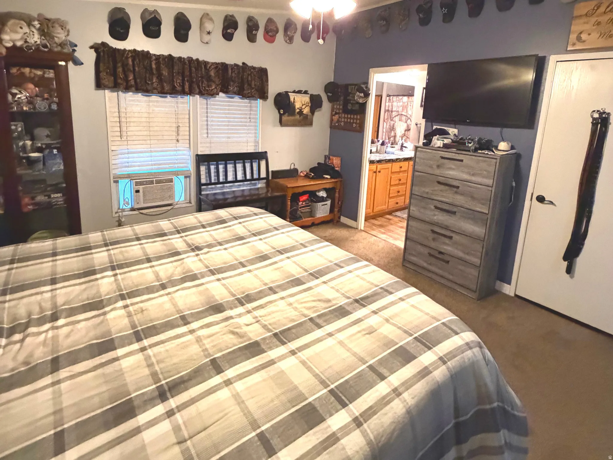 Bedroom with carpet flooring and a ceiling fan