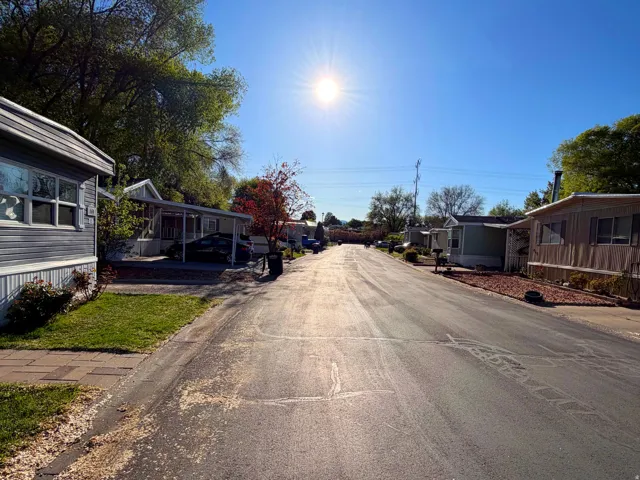 View of asphalt road with a residential view