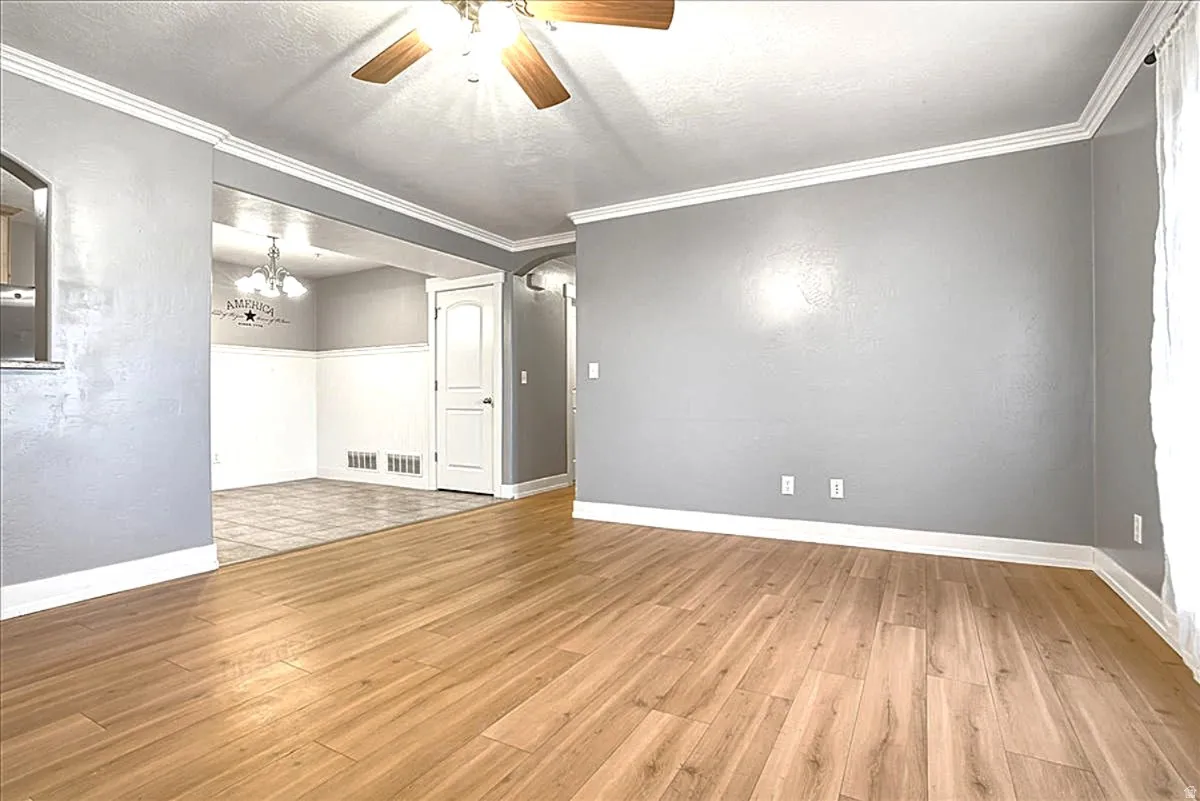 Flooring Color is More of a Taupe Color than What it Appears in the Photos.