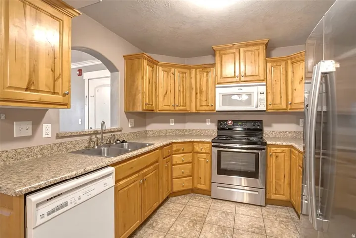 Light and Bright Kitchen with Stainless Steel Appliances.