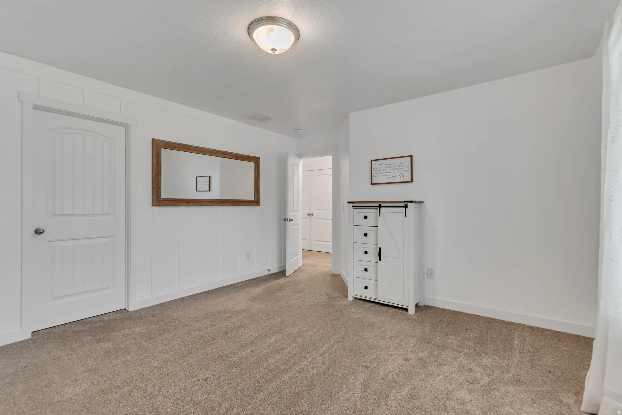 Unfurnished bedroom featuring carpet floors and baseboards