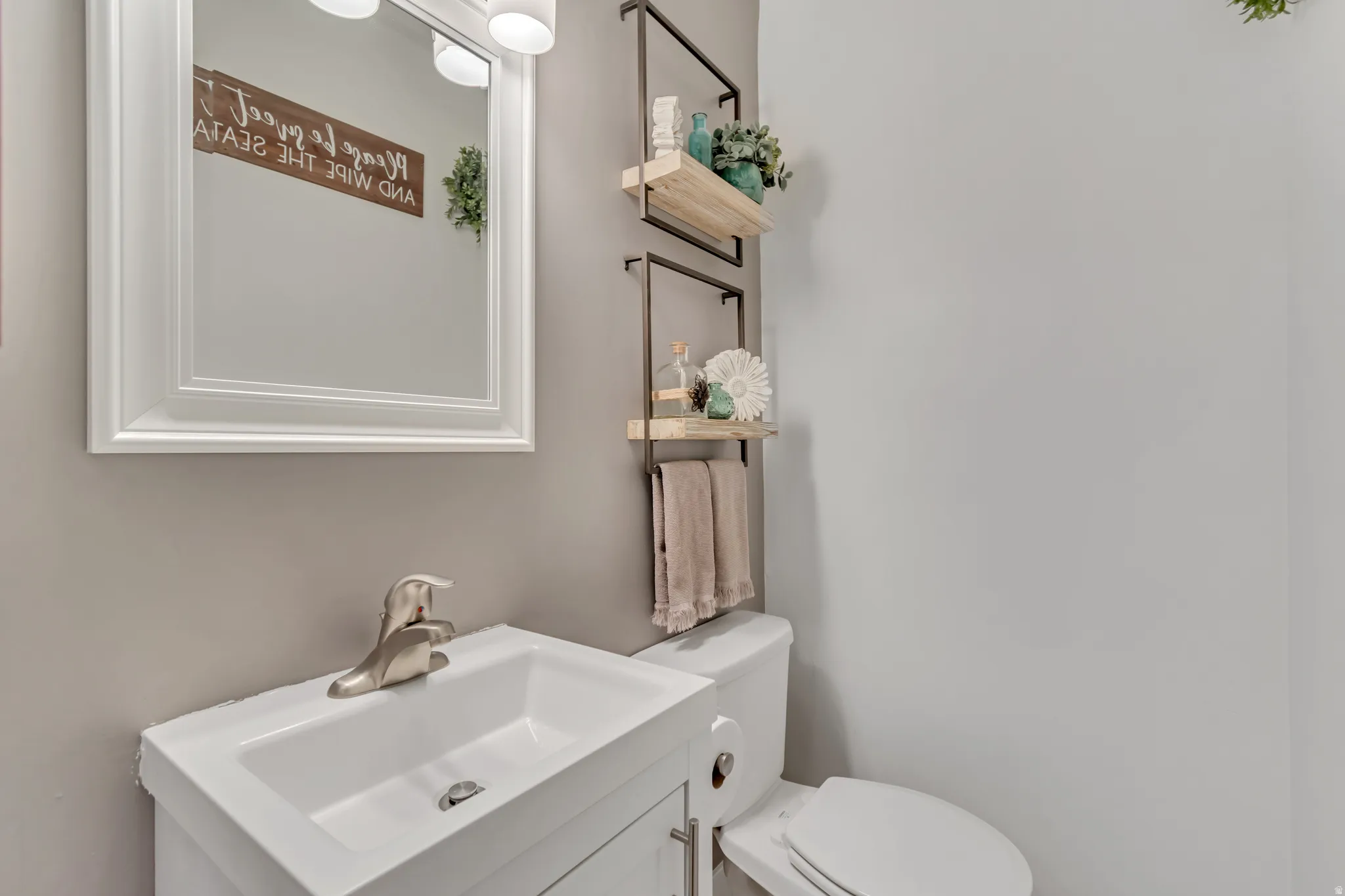Half bath with vanity and toilet