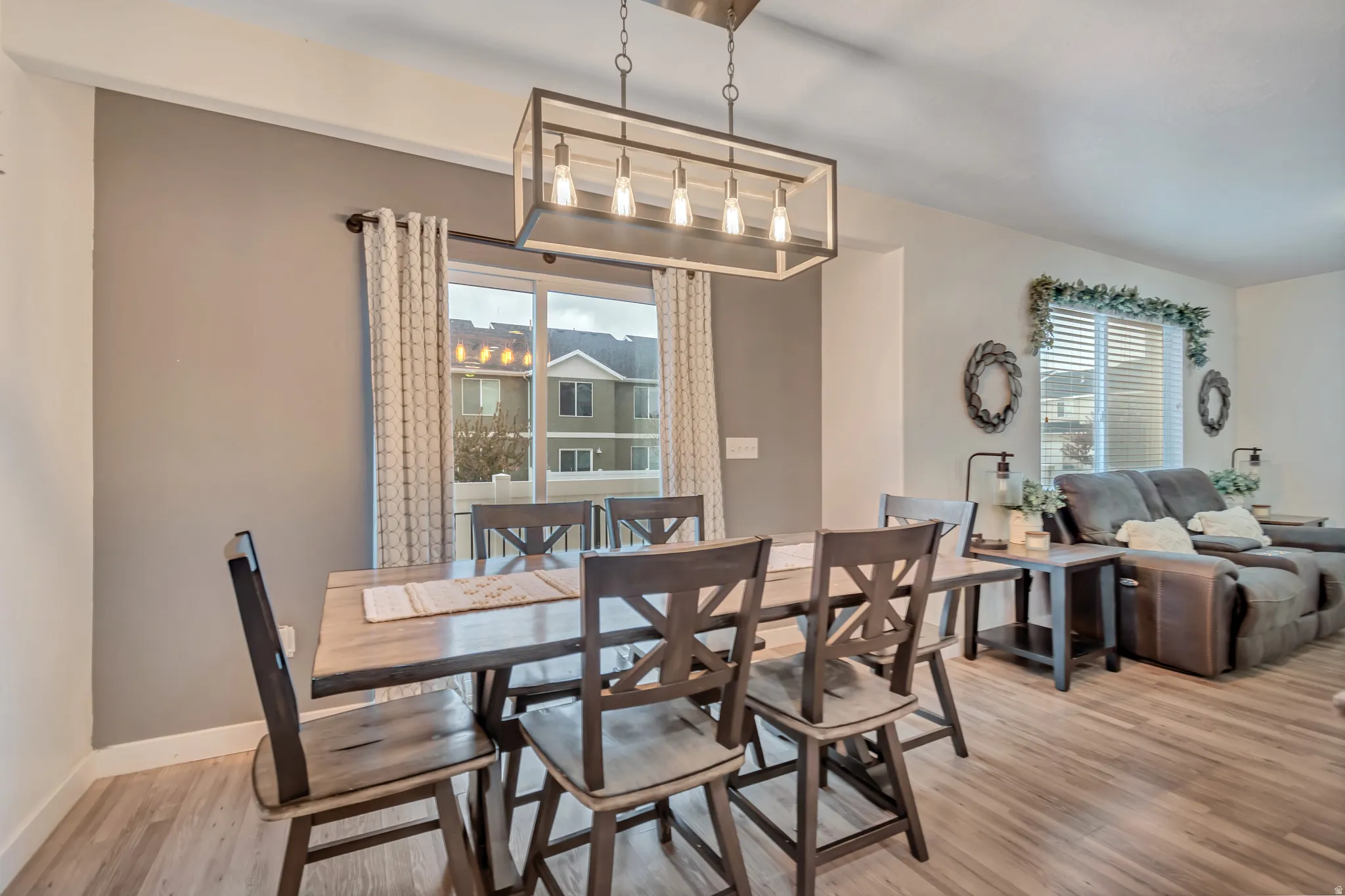 Dining area featuring light wood-type flooring and healthy amount of natural light