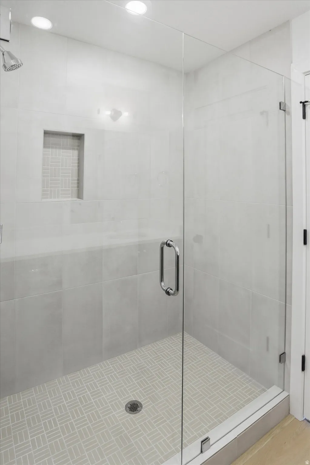 Full bathroom with a shower stall