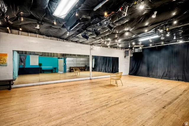 Misc room featuring hardwood / wood-style floors and a heating unit