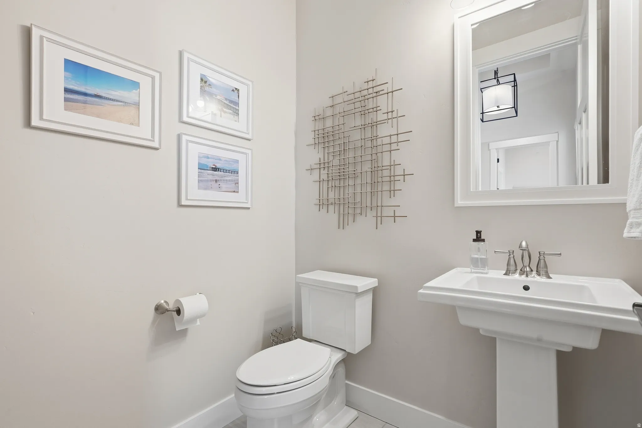 Half bath featuring toilet and tile patterned flooring
