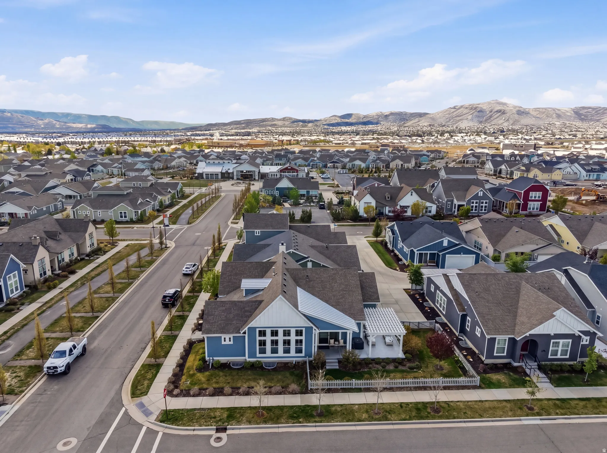 Aerial perspective of suburban area featuring a mountainous background