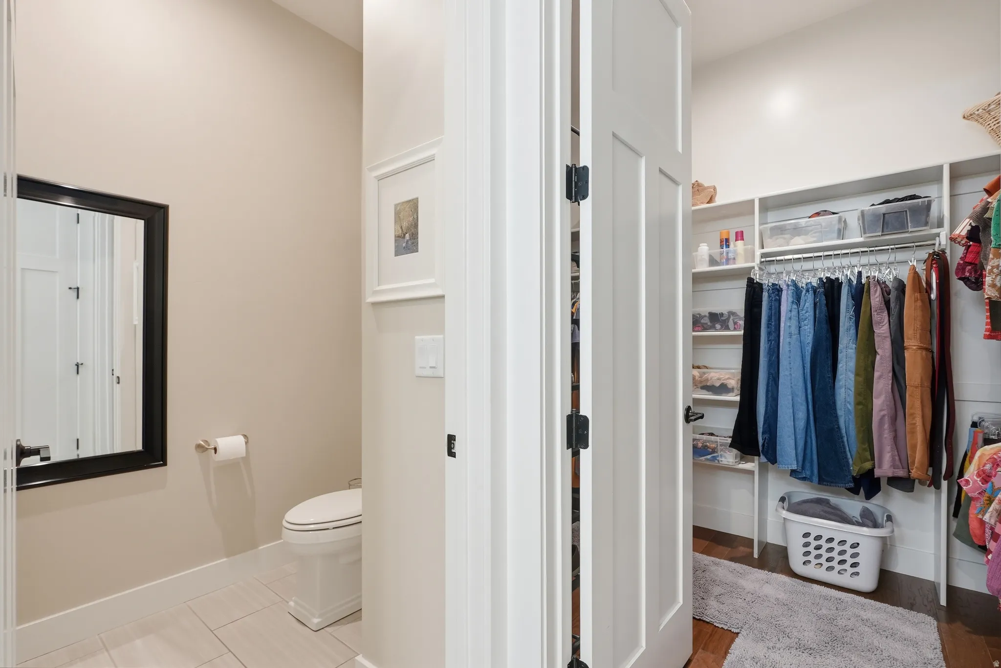 Bathroom featuring toilet and a walk in closet