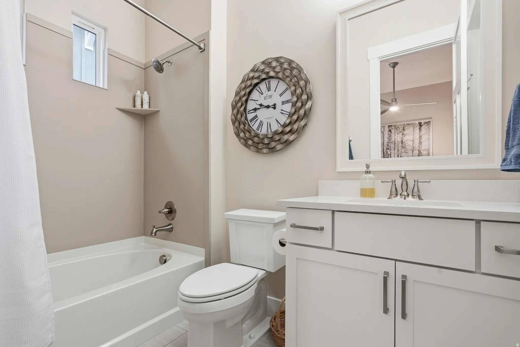 Bathroom with vanity and shower / bathtub combination with curtain