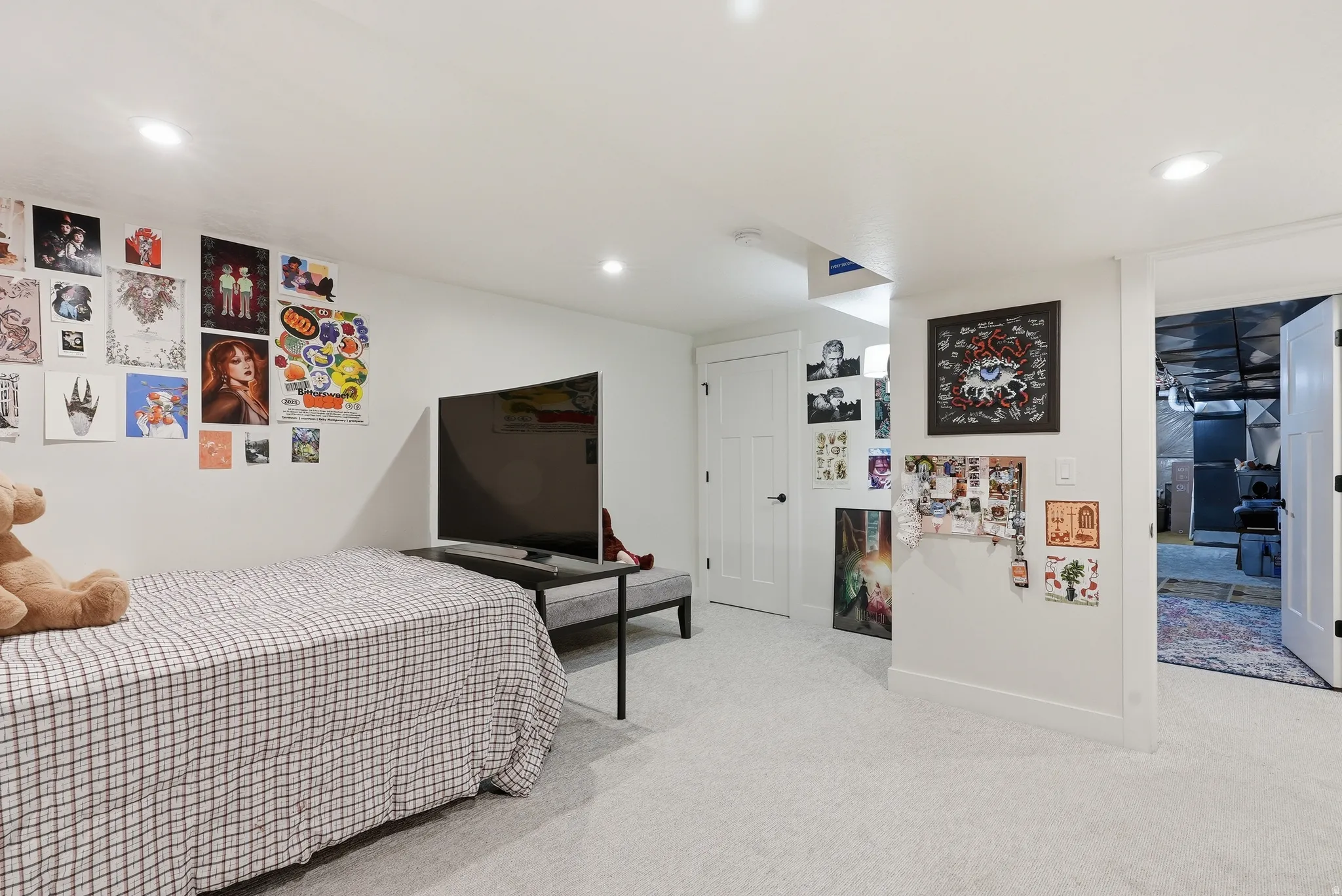 Bedroom featuring light colored carpet and recessed lighting