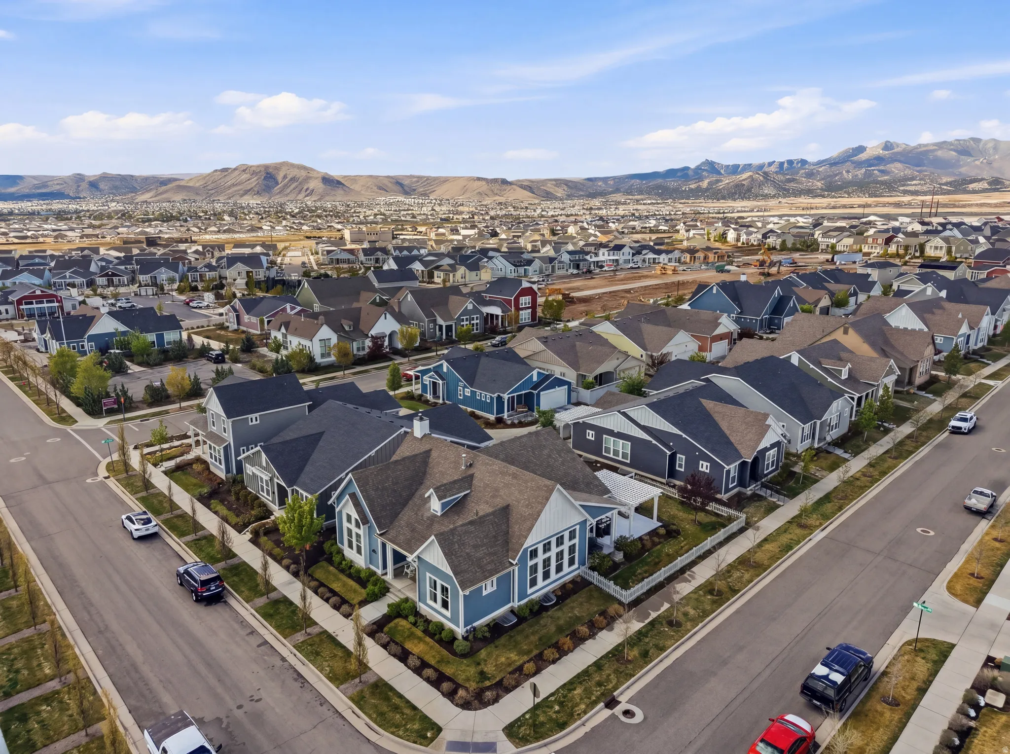Aerial view of residential area with a mountainous background