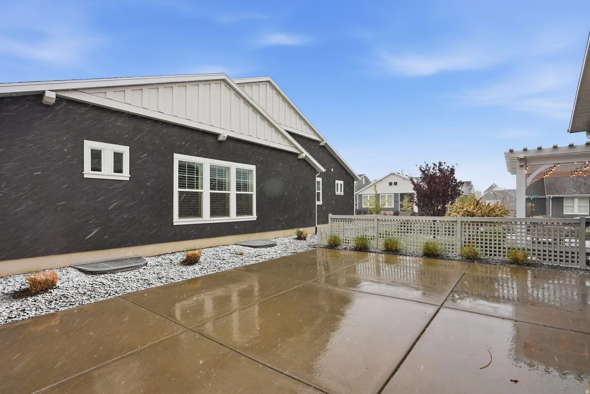 View of home's exterior with a patio and board and batten siding