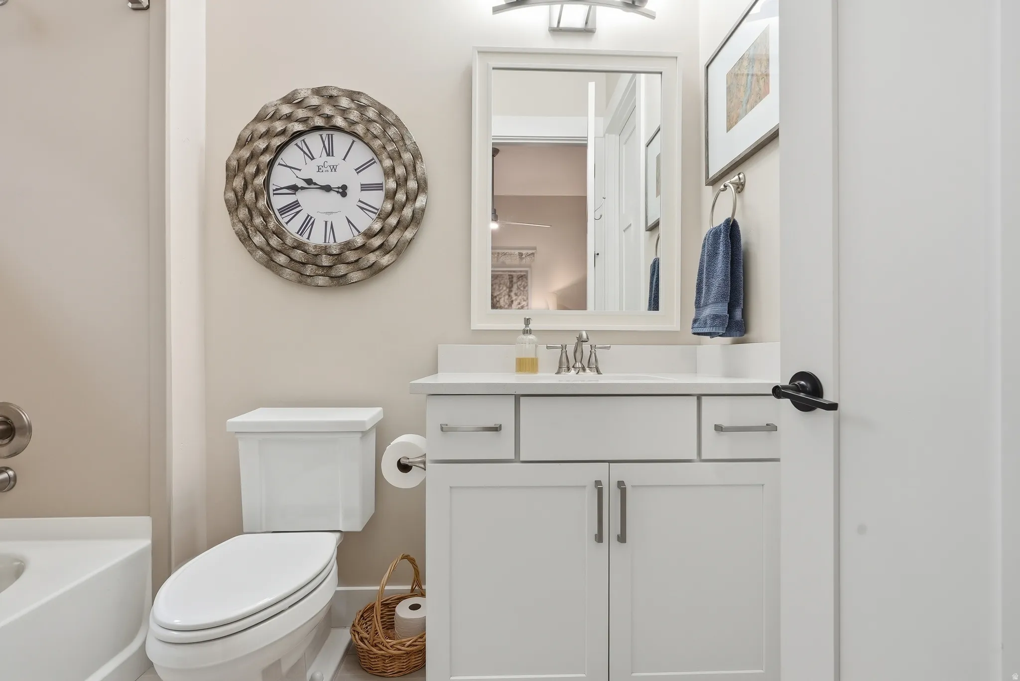 Bathroom featuring vanity and shower / bathtub combination