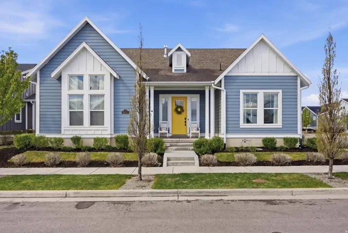 Bungalow-style house featuring a shingled roof, board and batten siding, and a porch
