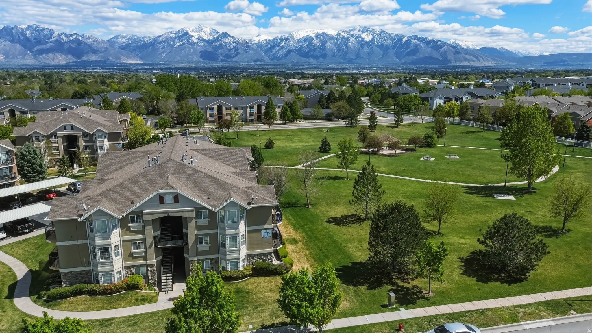 Aerial perspective of suburban area with a mountainous background