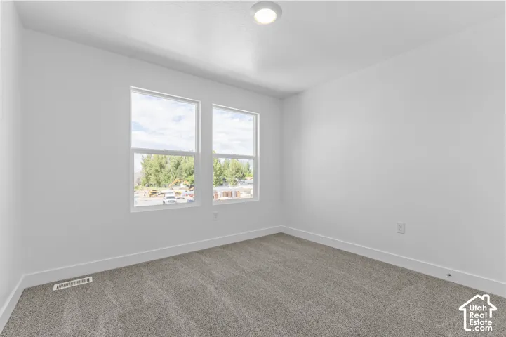 Neutral-toned carpeting throughout