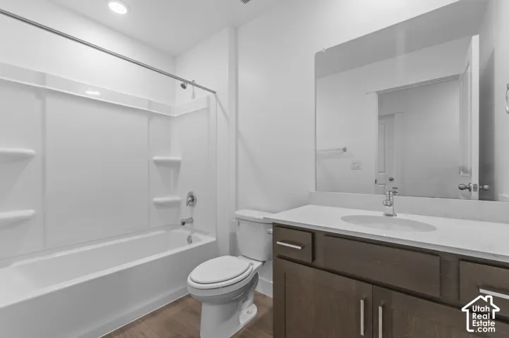 Vanity with a light-toned countertop, undermount sink, and chrome faucet