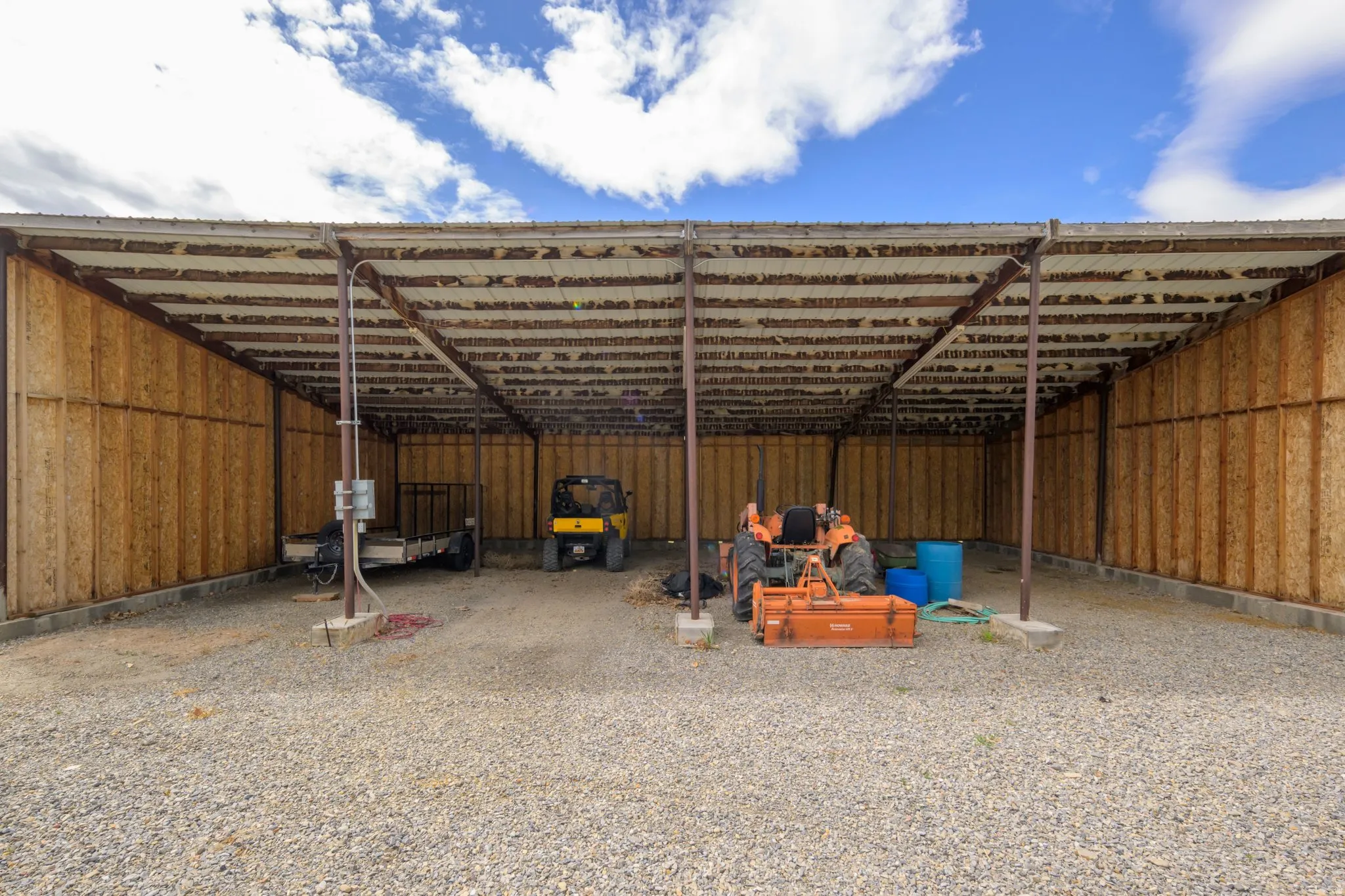 View of parking with a carport