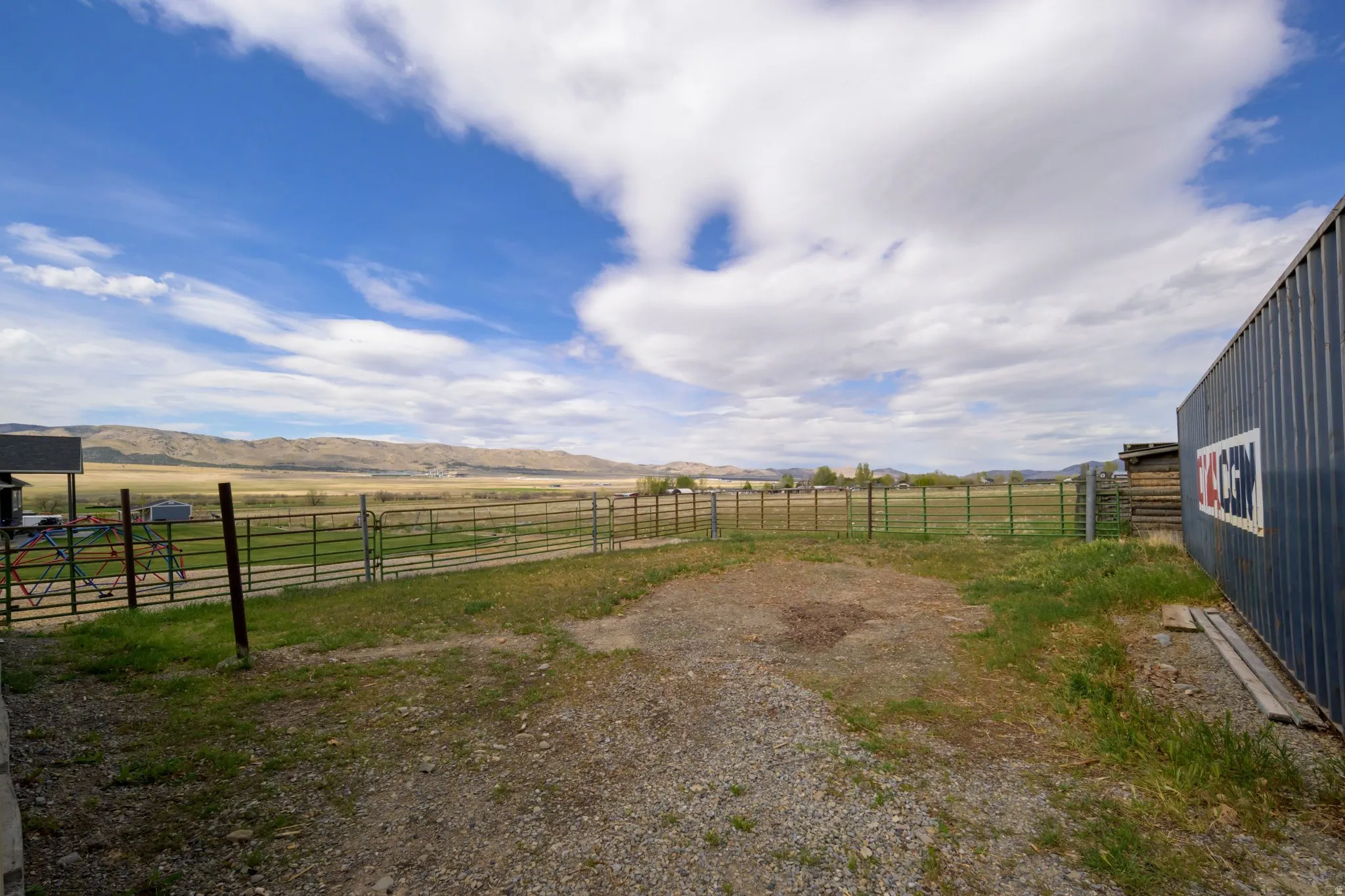View of yard with a mountain view and a rural view