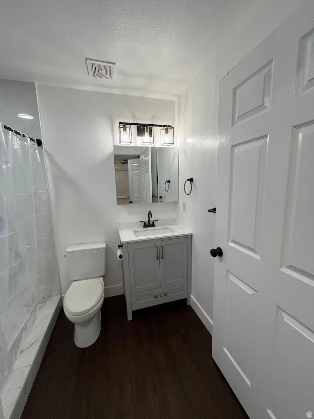 Remodeled master bathroom with new fixtures, storage, vanity and lighting.