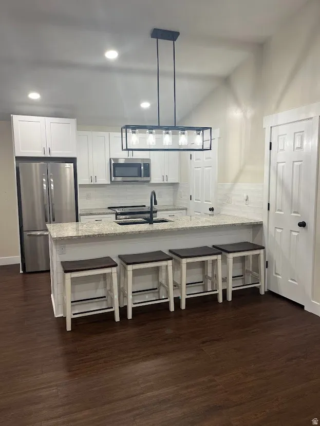 Fully remodeled kitchen with new cabinetry, easy care LVP flooring, granite countertops, and stainless steel appliance.