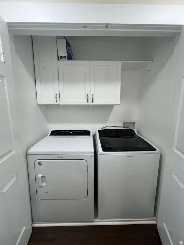 Laundry room with cabinet storage.