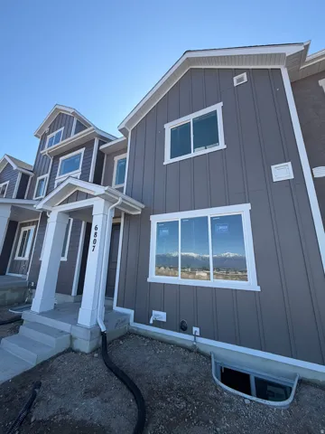 View of front of property featuring board and batten siding
