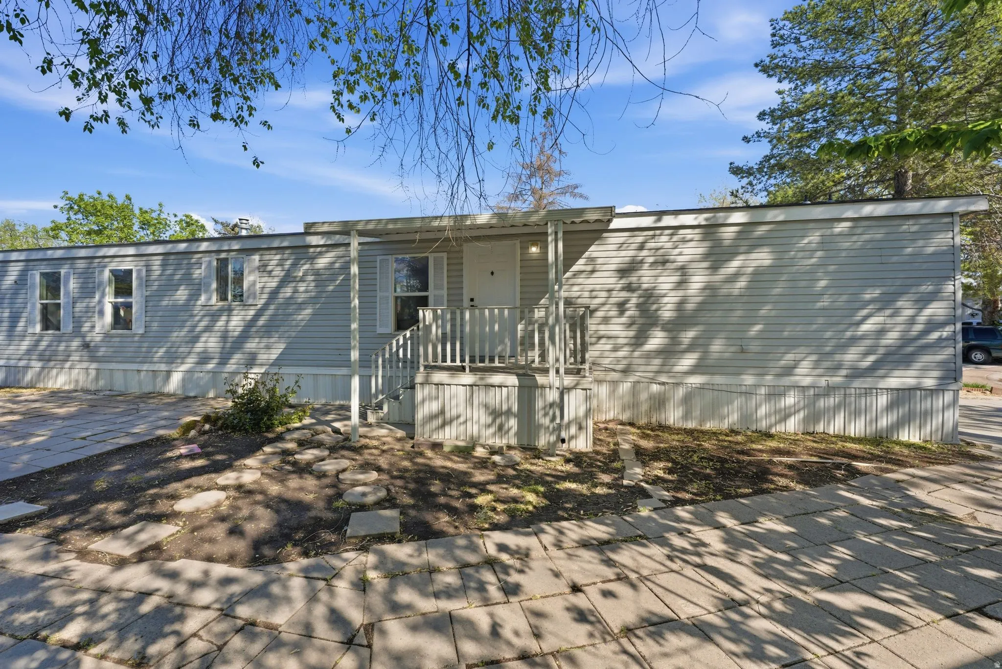 Back of house with a patio
