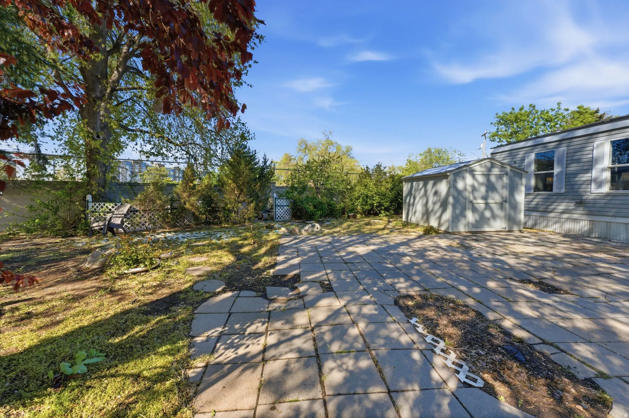 View of patio / terrace featuring a shed