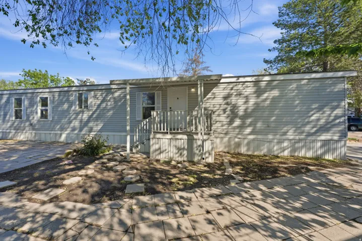 Back of house with a patio