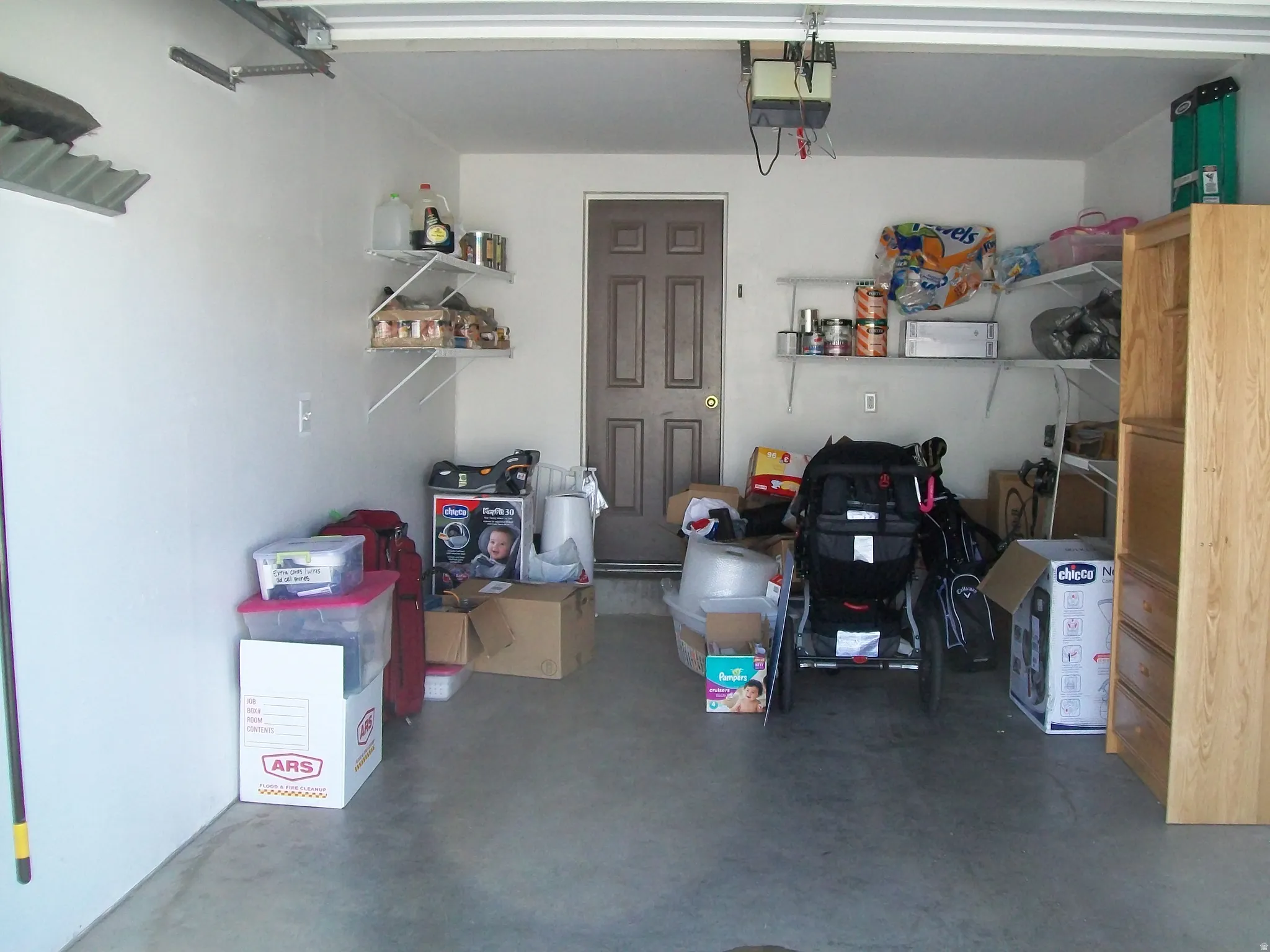 Garage featuring a garage door opener
