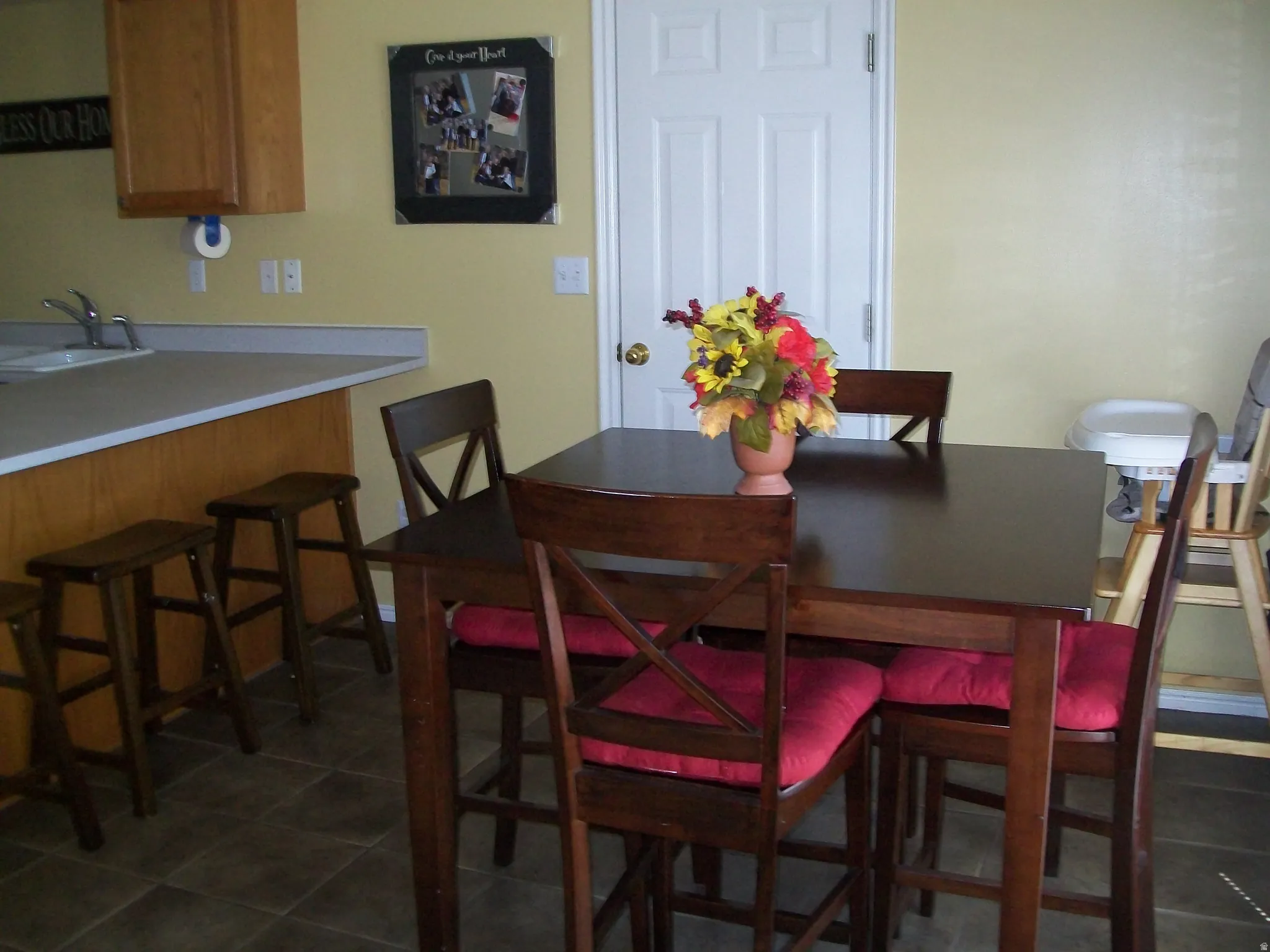 Dining room featuring dark tile patterned flooring