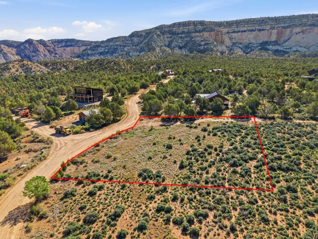 View of property location with property boundaries highlighted and a mountainous background