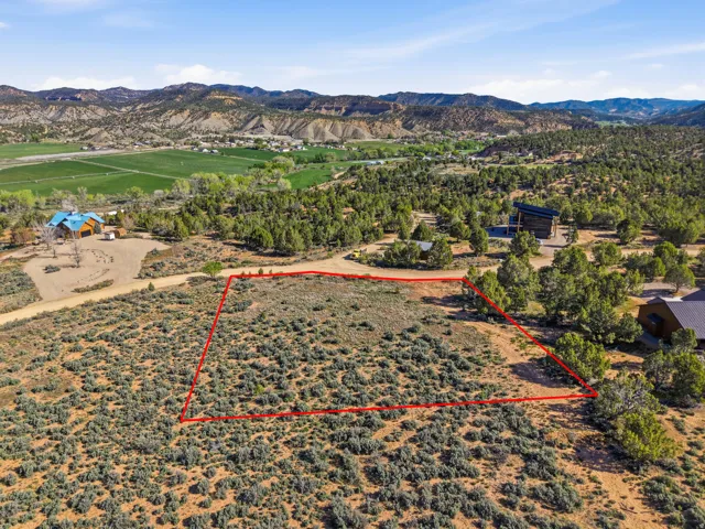 Overview of landscape with property parcel outlined and mountains