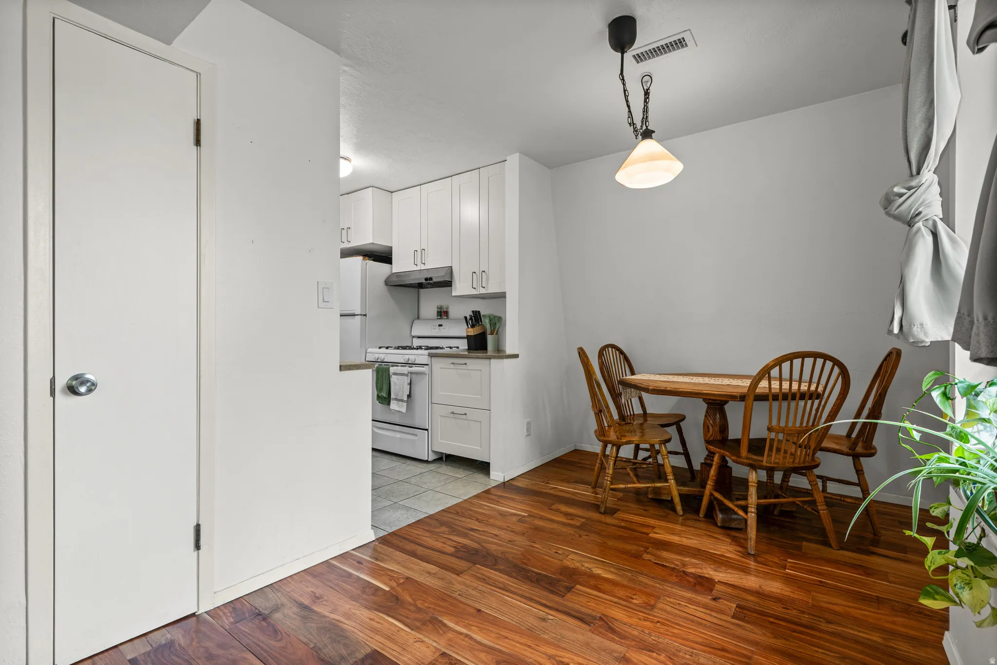 Dining area with hardwood flooring