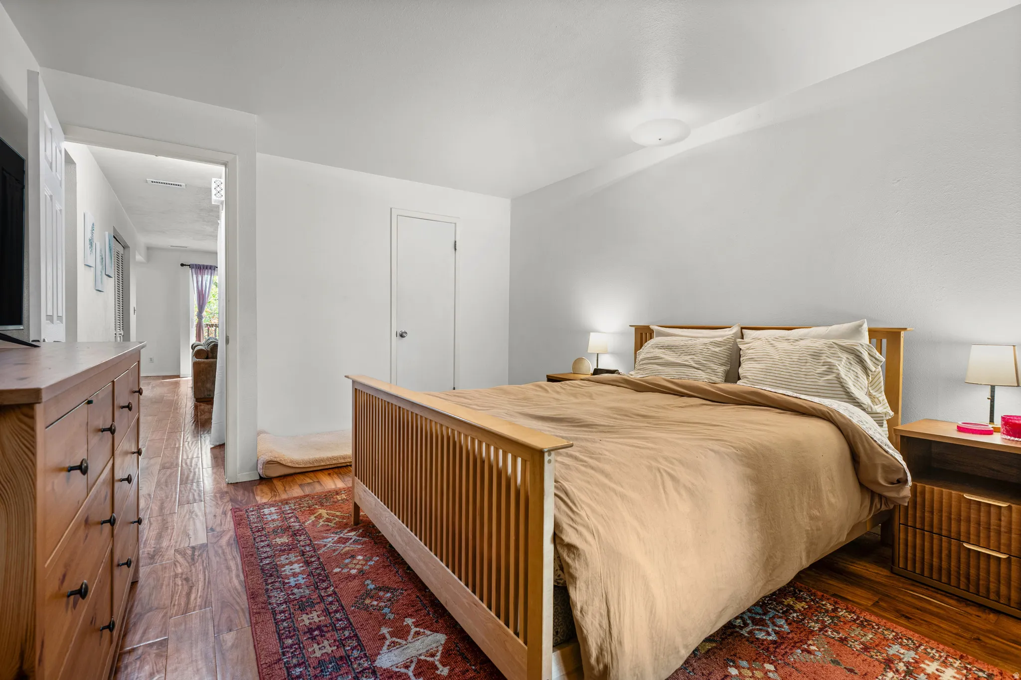 Bedroom with hardwood flooring