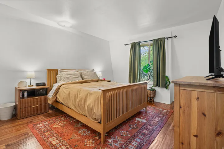 Bedroom featuring hardwood flooring
